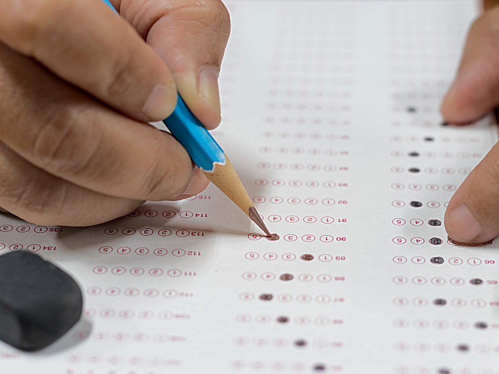 Peron filling in circles on standardized test sheet.